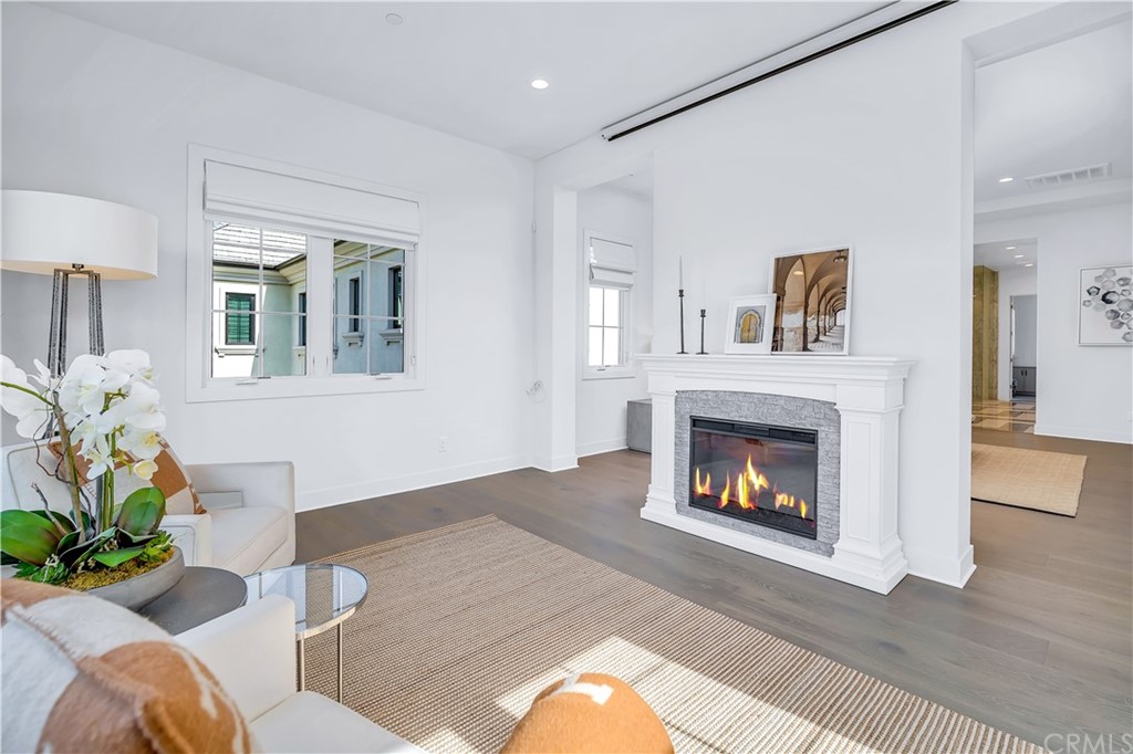 51 Interstellar Irvine, CA 92618 - Photo 29 of 51 a living room with furniture and a fireplace
