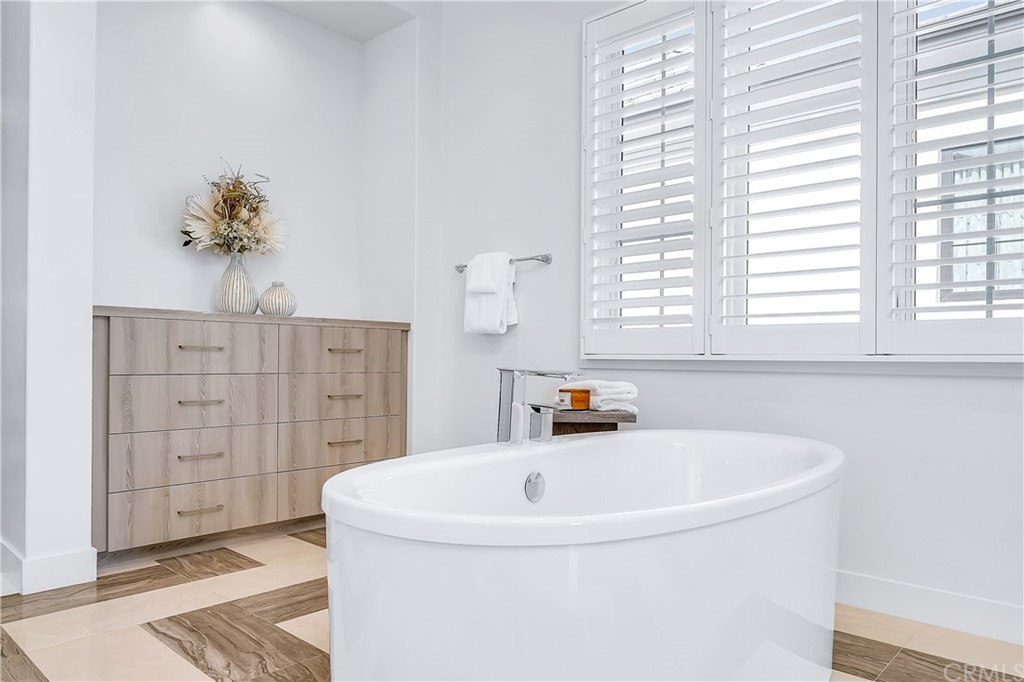 51 Interstellar Irvine, CA 92618 - Photo 32 of 51 a bath tub sitting in a bathroom next to a window