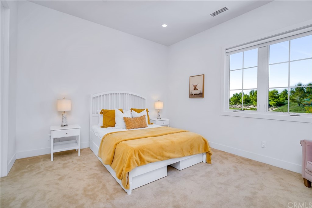 51 Interstellar Irvine, CA 92618 - Photo 40 of 51 a bedroom with a bed and a window