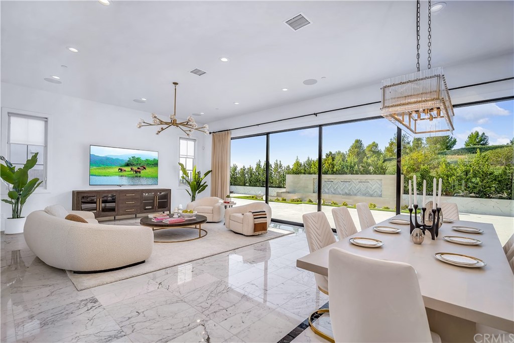51 Interstellar Irvine, CA 92618 - Photo 4 of 51 a living room with furniture and a flat screen tv