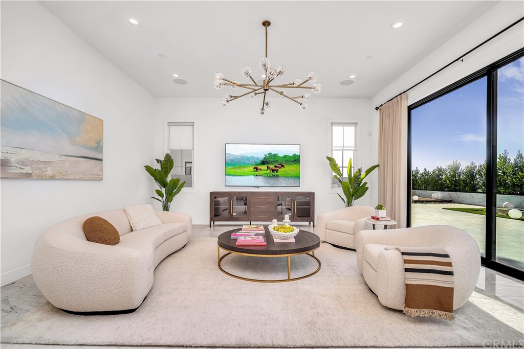 51 Interstellar Irvine, CA 92618 - Photo 5 of 51 a living room with furniture and a floor to ceiling window