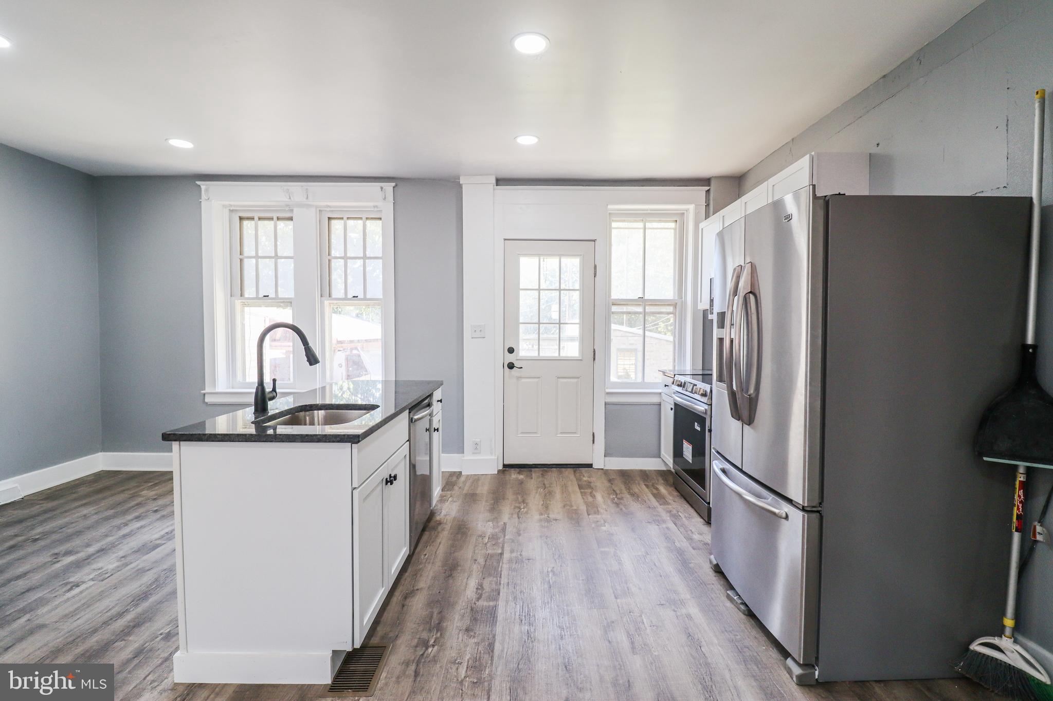 68 South Albemarle Street York, PA 17403 - Photo 9 of 25 a kitchen with sink a refrigerator and a stove