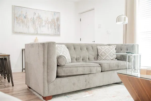 a living room with furniture and a couch