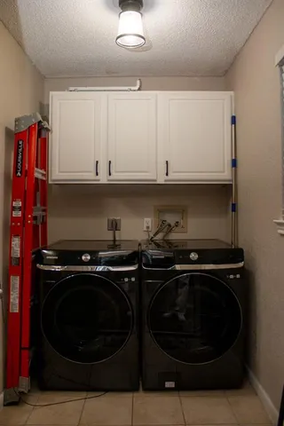 a kitchen with wooden cabinets and a stove top oven