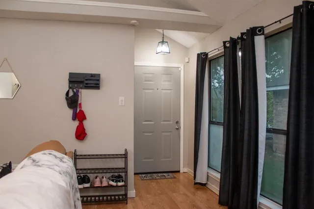 a bedroom with a bed and a walk in closet
