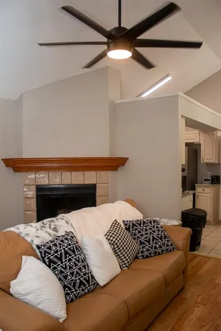 a bedroom with a bed and ceiling fan