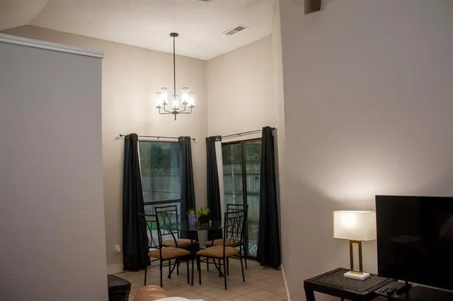 a view of a livingroom with furniture window and wooden floor