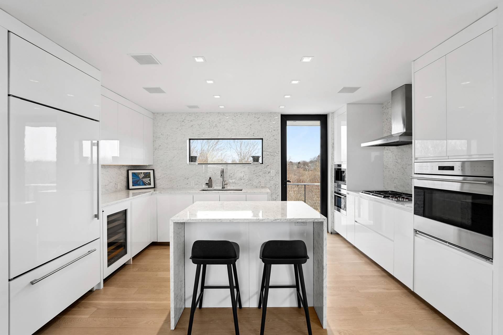 15 Deforest Road Montauk, NY 11954 - Photo 7 of 22 a large kitchen with a table and chairs