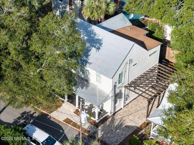 an aerial view of house with yard