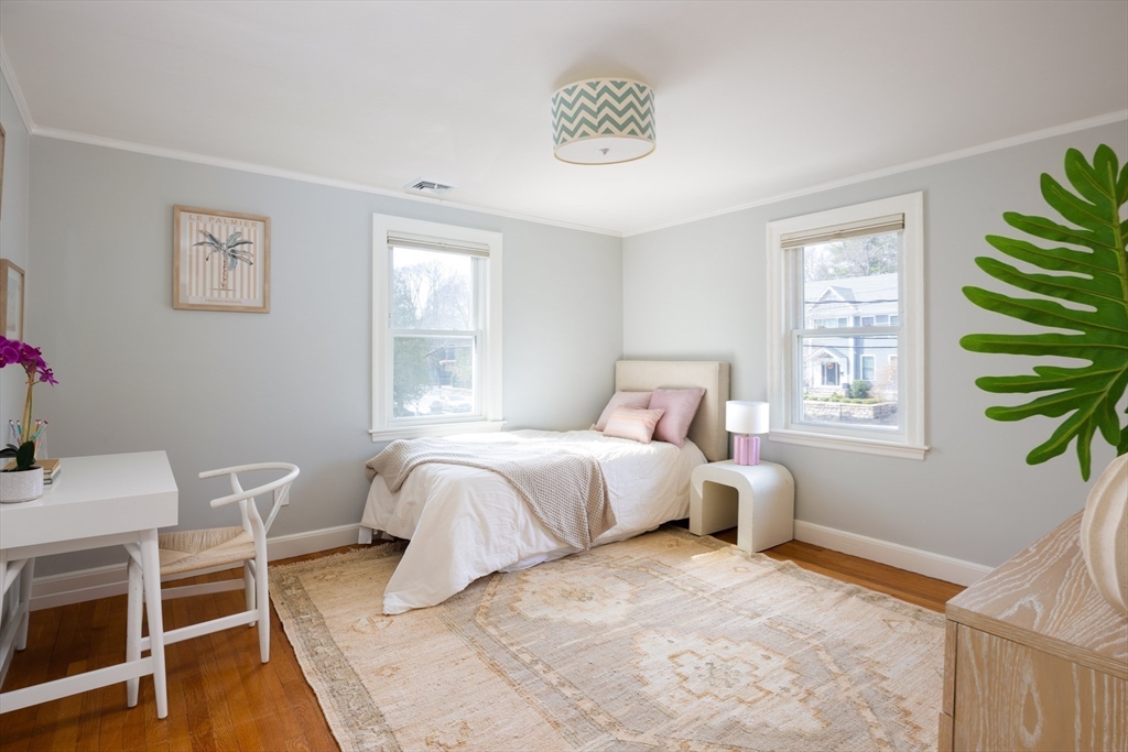 680 Beacon Street Newton, MA 02459 - Photo 13 of 26 a bedroom with a bed and a window