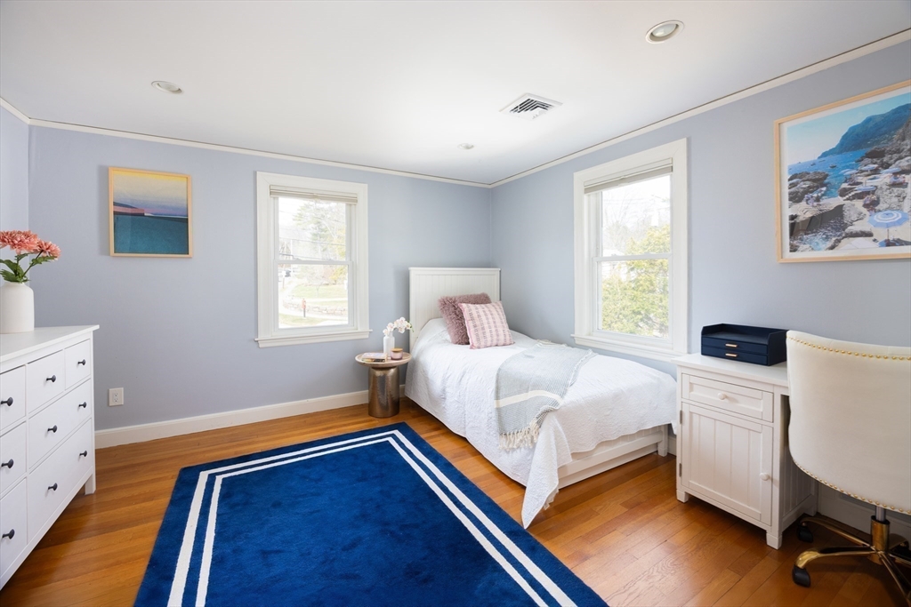 680 Beacon Street Newton, MA 02459 - Photo 14 of 26 a bedroom with a bed and a dresser in it