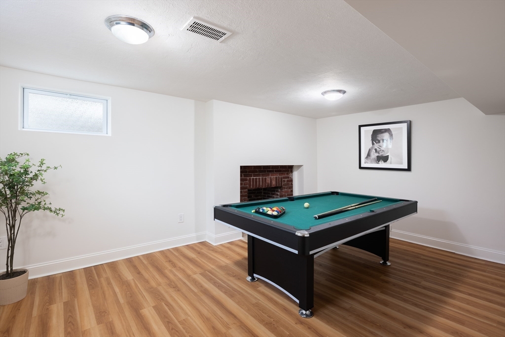 680 Beacon Street Newton, MA 02459 - Photo 19 of 26 a room with furniture pool table and potted plants