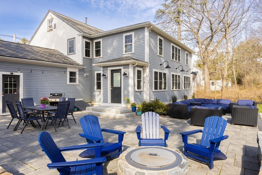 680 Beacon Street Newton, MA 02459 - Photo 20 of 26 a view of a house and a dinning table and chairs in patio
