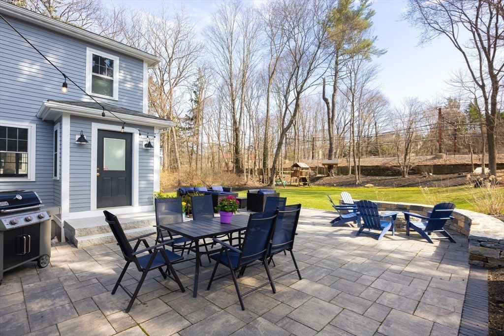 680 Beacon Street Newton, MA 02459 - Photo 21 of 26 a view of a swimming pool with chairs and table in the patio