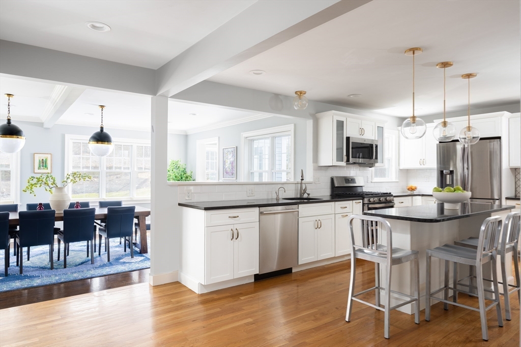 680 Beacon Street Newton, MA 02459 - Photo 7 of 26 a kitchen with appliances a sink a counter top space and living room view