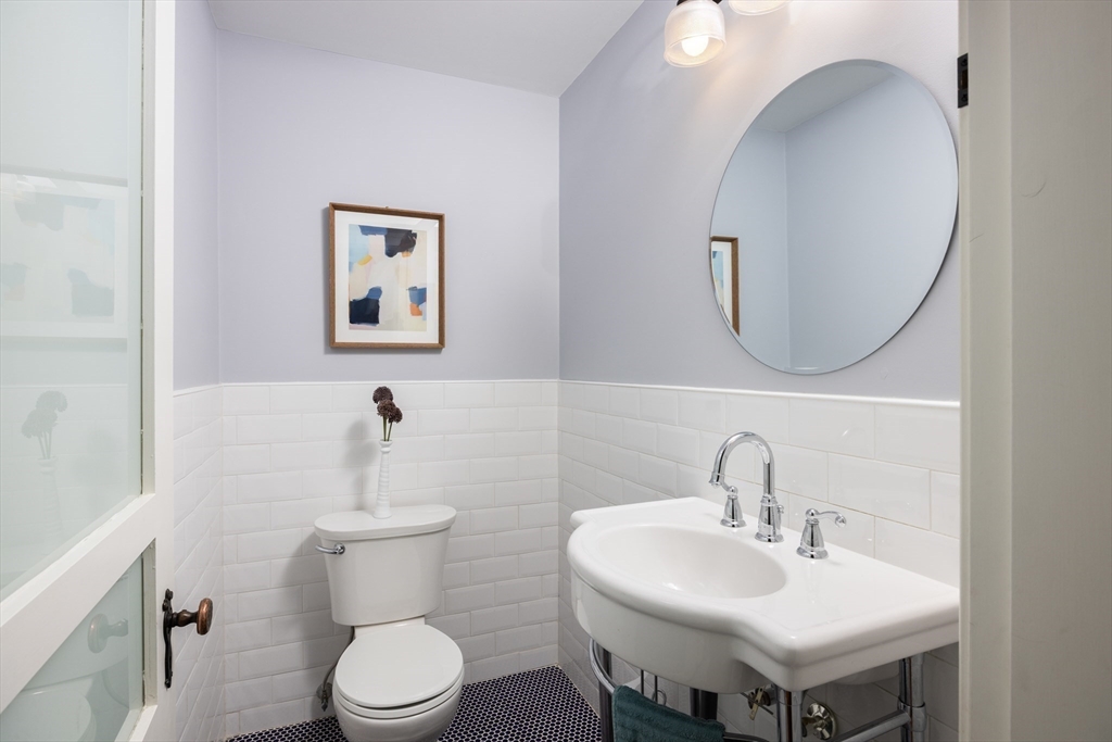 680 Beacon Street Newton, MA 02459 - Photo 10 of 26 a bathroom with a toilet a sink and mirror