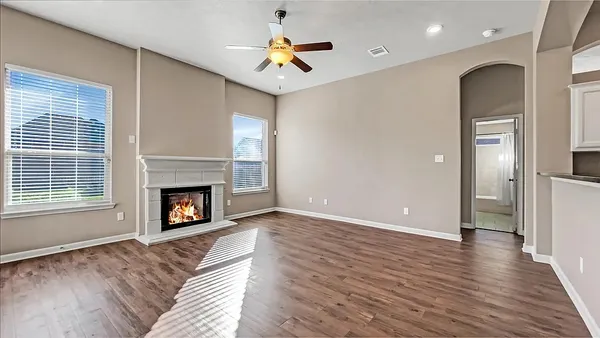 a view of a livingroom with a fireplace a fireplace and wooden floor