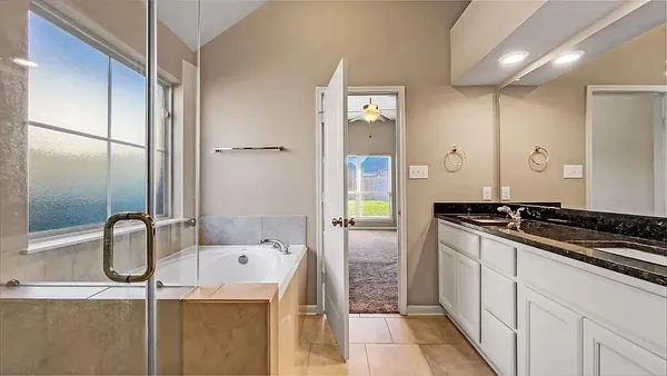 a kitchen with a refrigerator and a sink