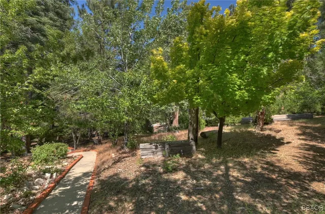 a view of outdoor sitting space and wooden deck