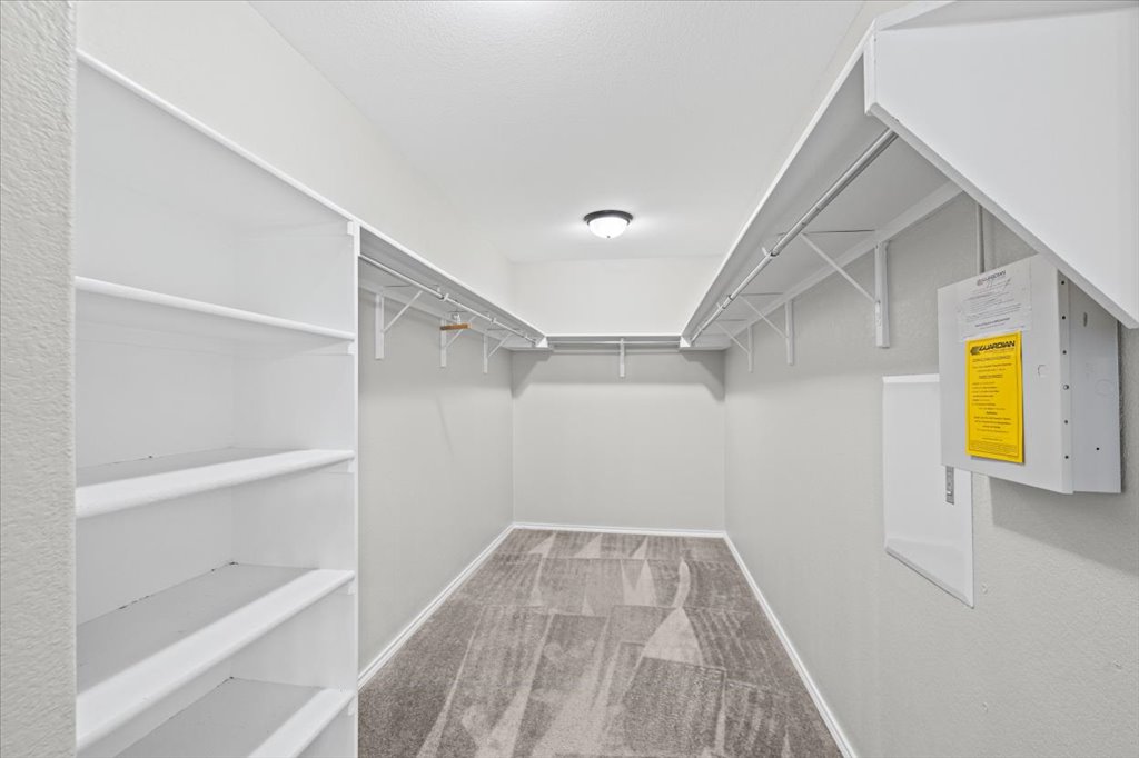 8804 Capitol View Drive Austin, TX 78747 - Photo 26 of 32 a view of walk in closet with empty racks