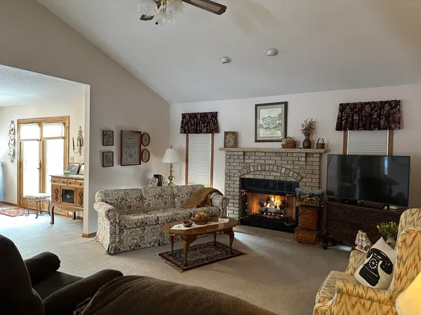 a bedroom with a bed and a lamp on table