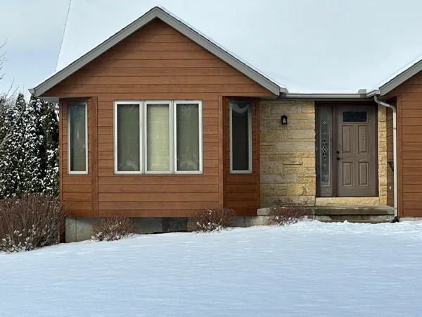 a bedroom with a bed and a television