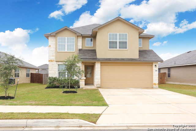 220 Grand Rapids Cibolo, TX 78108 - Photo 1 of 1 a front view of a house with a yard
