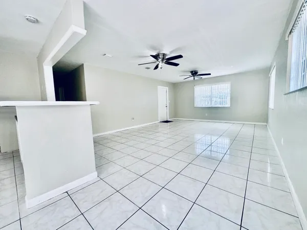 a view of an empty room with a window