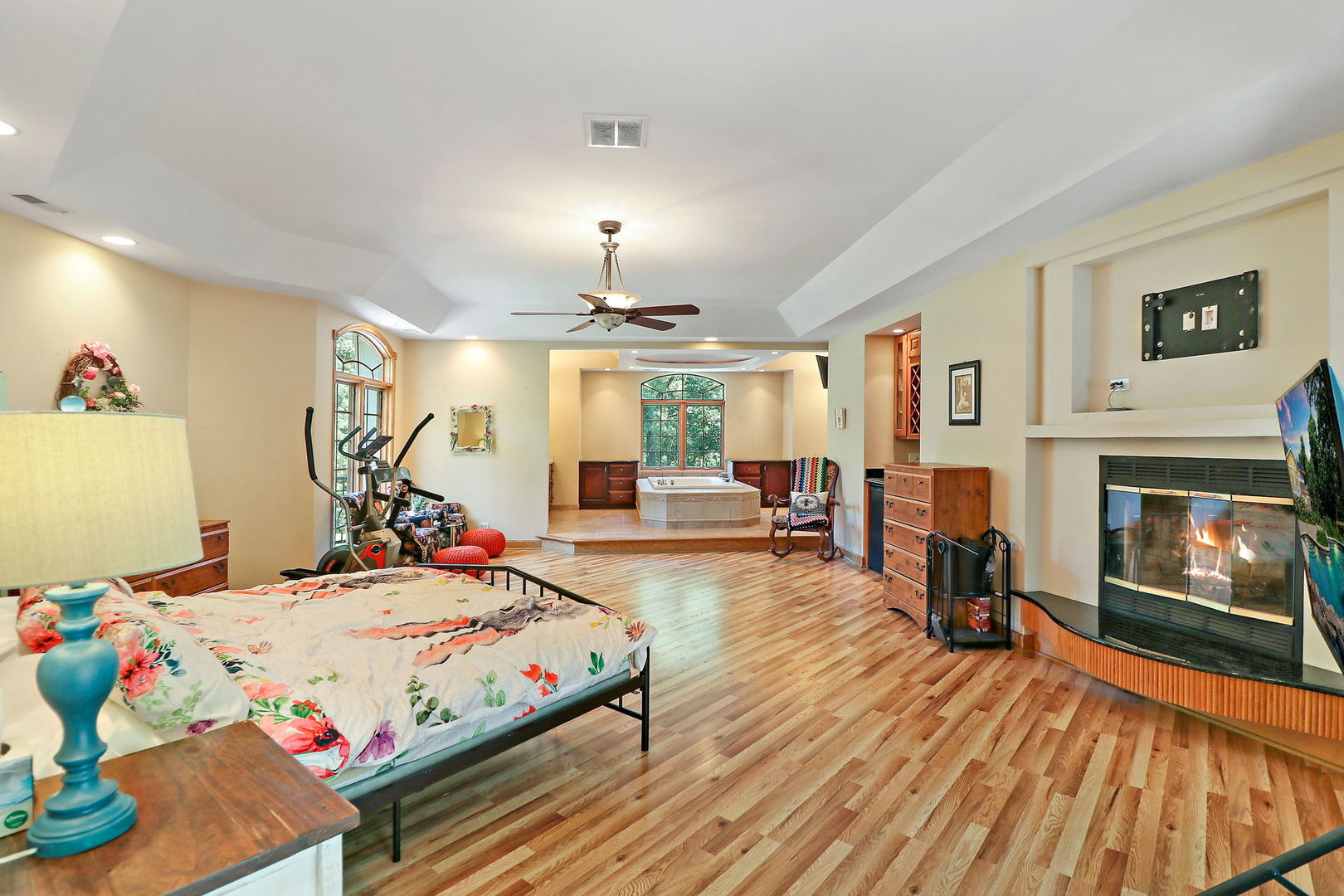 4602 Sunnyside Road Woodstock, IL 60098 - Photo 13 of 73 a bedroom with furniture and a fireplace