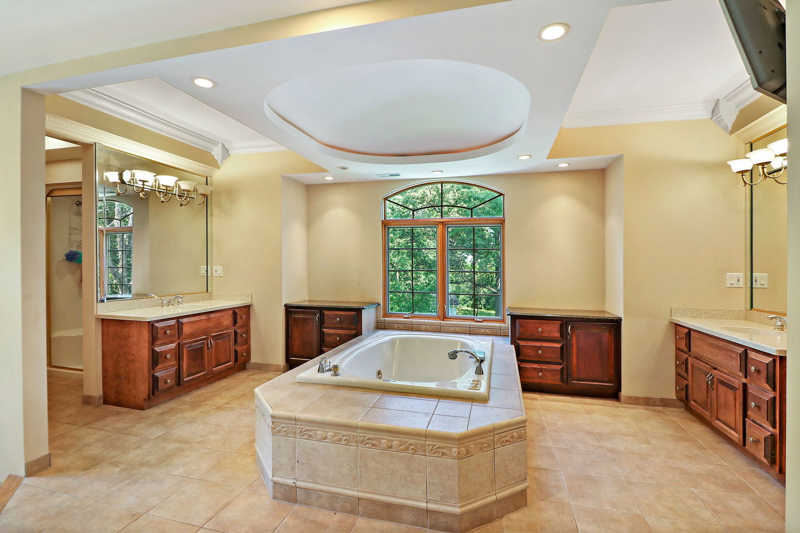 4602 Sunnyside Road Woodstock, IL 60098 - Photo 14 of 73 a spacious bathroom with a tub sink and mirror
