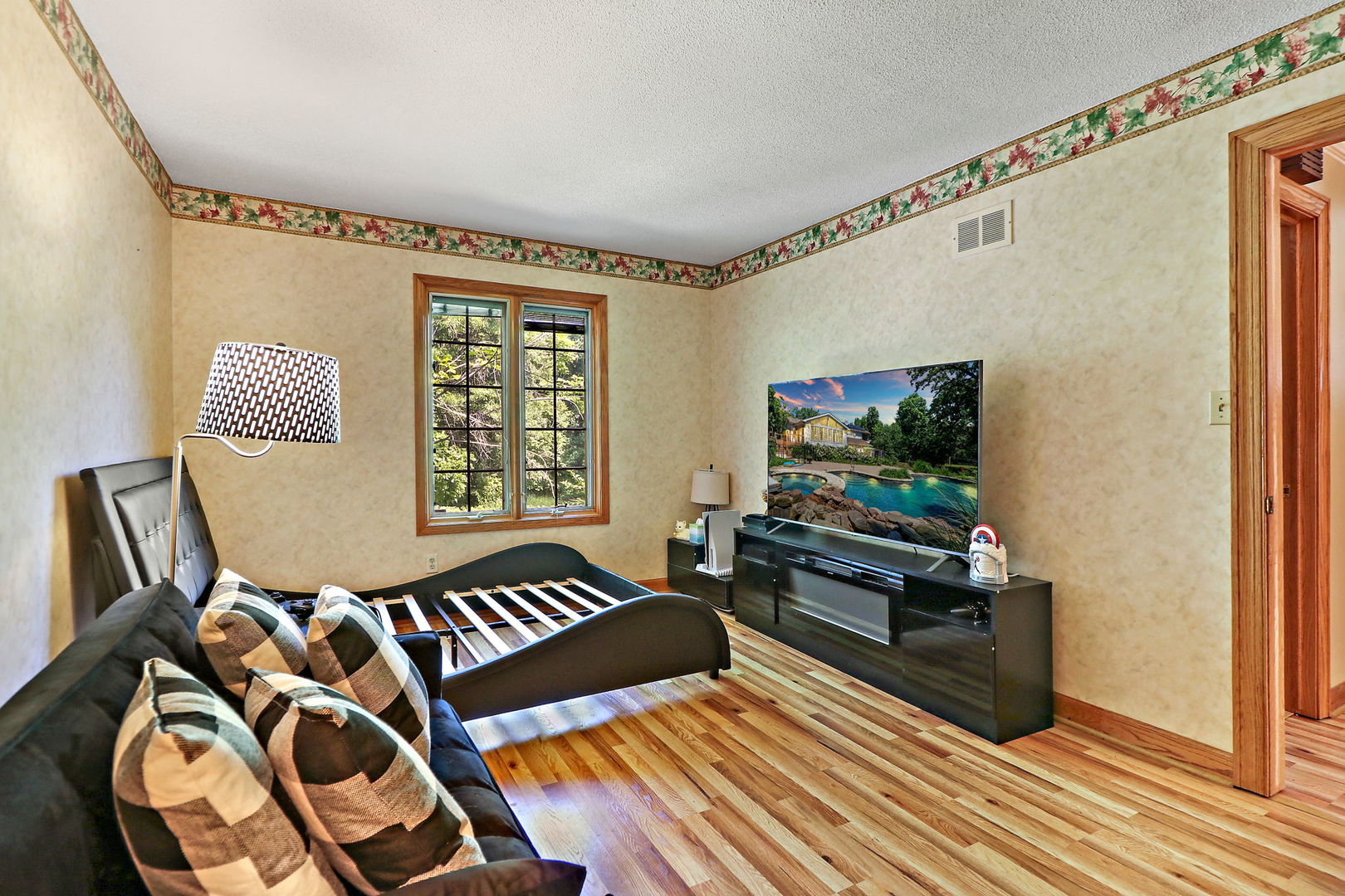 4602 Sunnyside Road Woodstock, IL 60098 - Photo 22 of 73 a living room with furniture and a flat screen tv