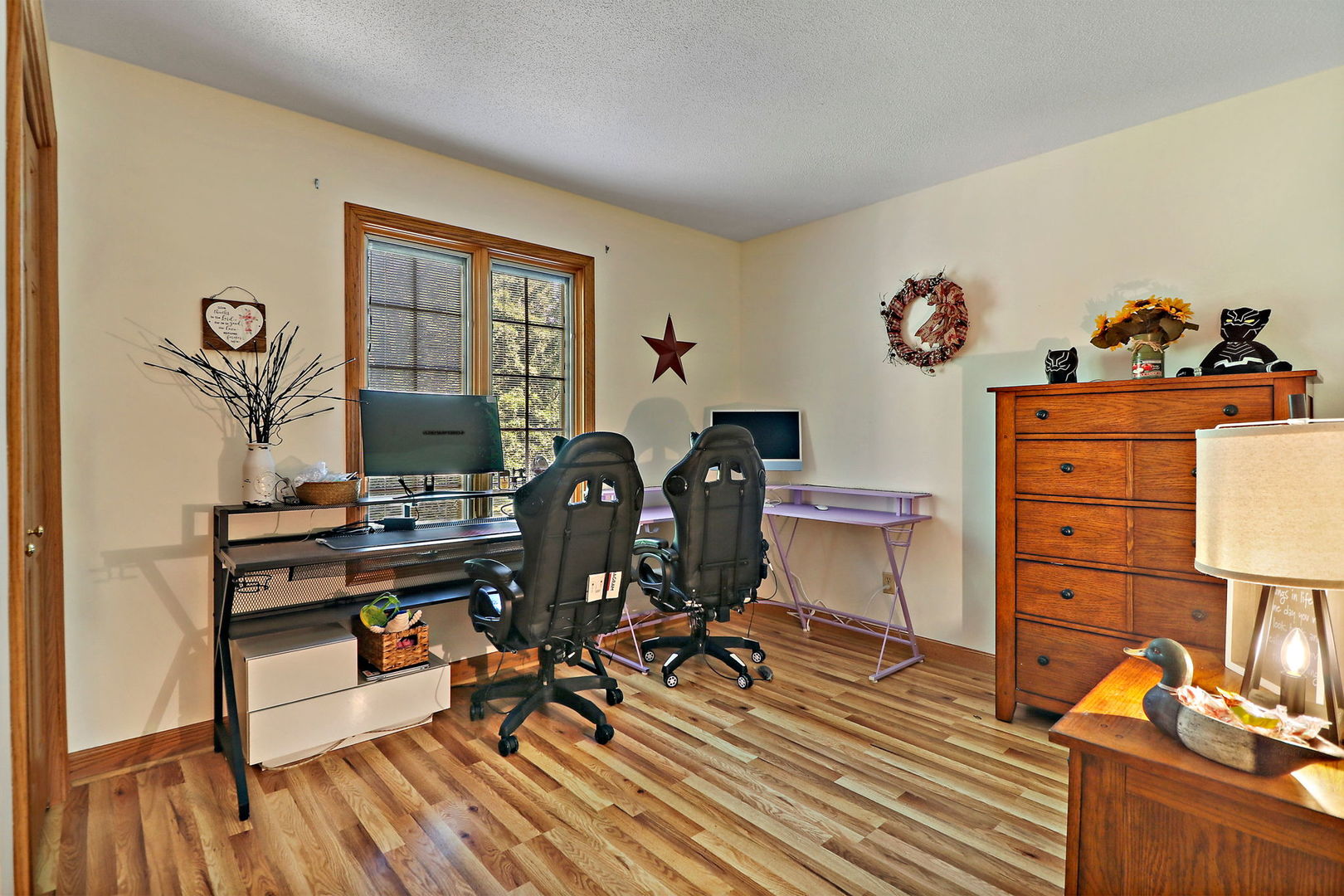 4602 Sunnyside Road Woodstock, IL 60098 - Photo 24 of 73 a view of a workspace with furniture and a window