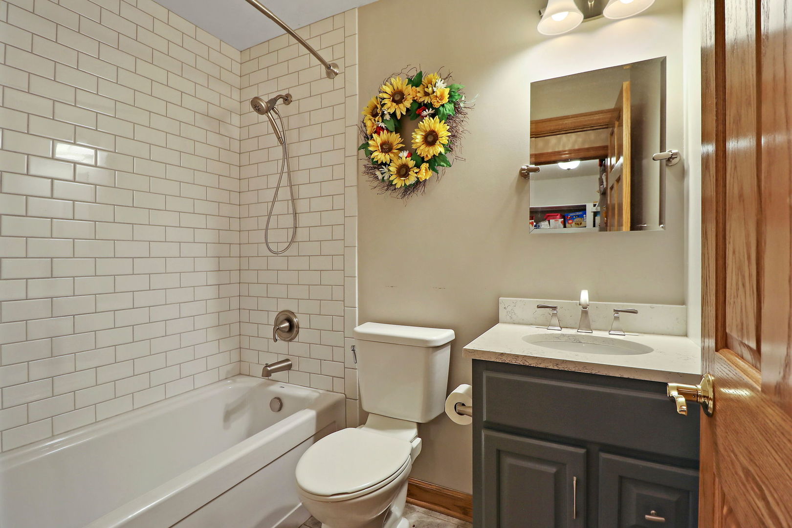 4602 Sunnyside Road Woodstock, IL 60098 - Photo 30 of 73 a bathroom with a sink a toilet and shower