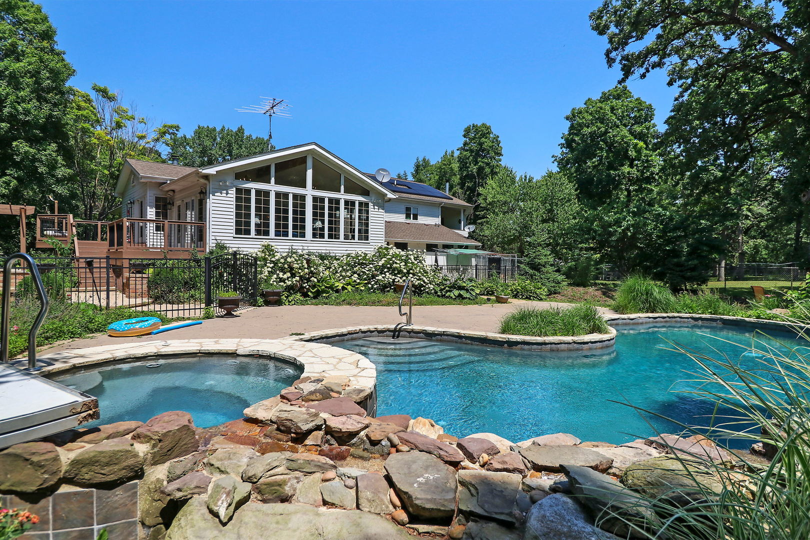 4602 Sunnyside Road Woodstock, IL 60098 - Photo 3 of 73 a view of a lake with a house swimming pool and outdoor space