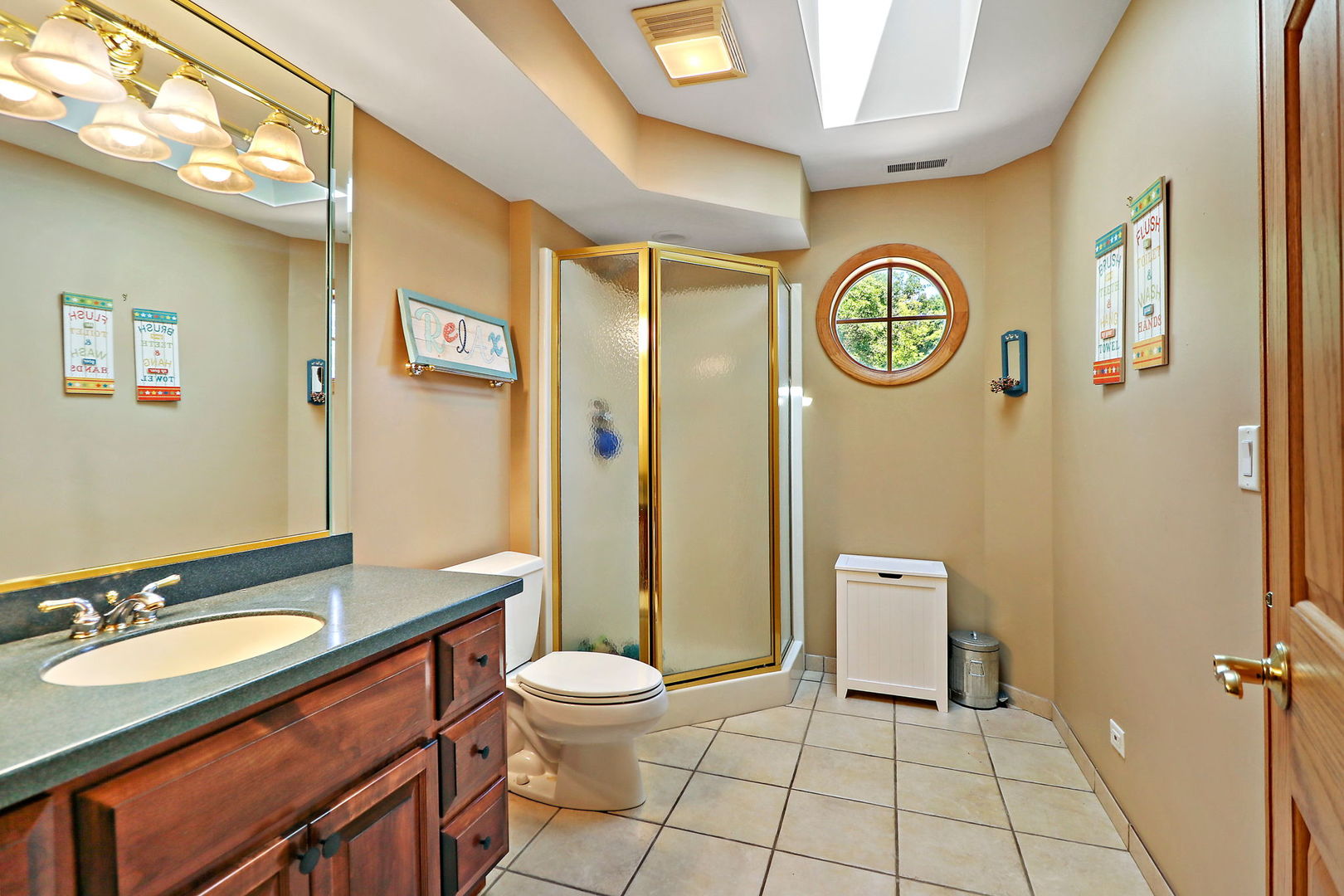 4602 Sunnyside Road Woodstock, IL 60098 - Photo 32 of 73 a bathroom with a sink a toilet and shower