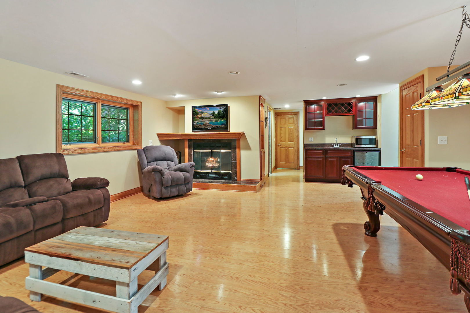 4602 Sunnyside Road Woodstock, IL 60098 - Photo 35 of 73 a living room with furniture and a flat screen tv