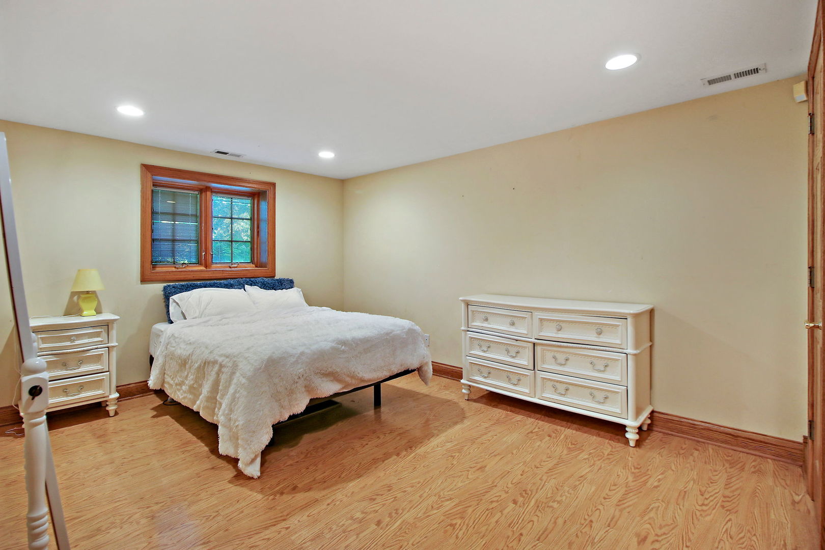 4602 Sunnyside Road Woodstock, IL 60098 - Photo 36 of 73 a spacious bedroom with a bed and a window