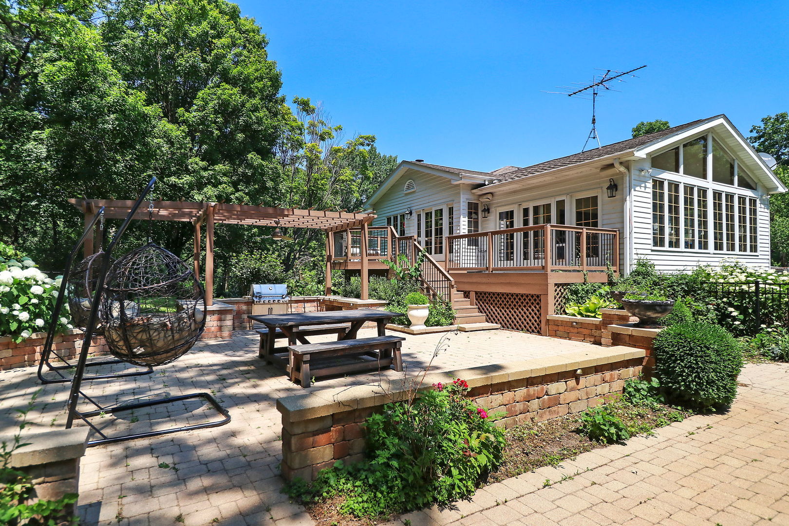 4602 Sunnyside Road Woodstock, IL 60098 - Photo 42 of 73 a view of a house with backyard sitting area and garden