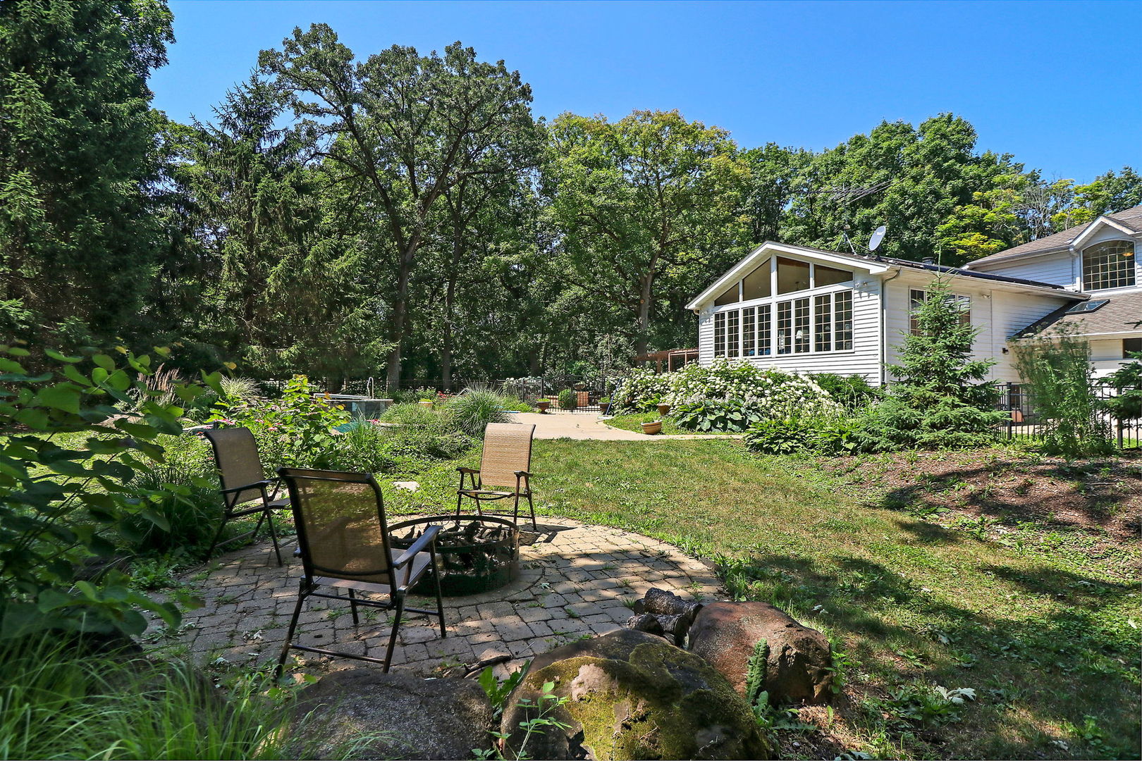 4602 Sunnyside Road Woodstock, IL 60098 - Photo 48 of 73 a view of a chair and table in the garden