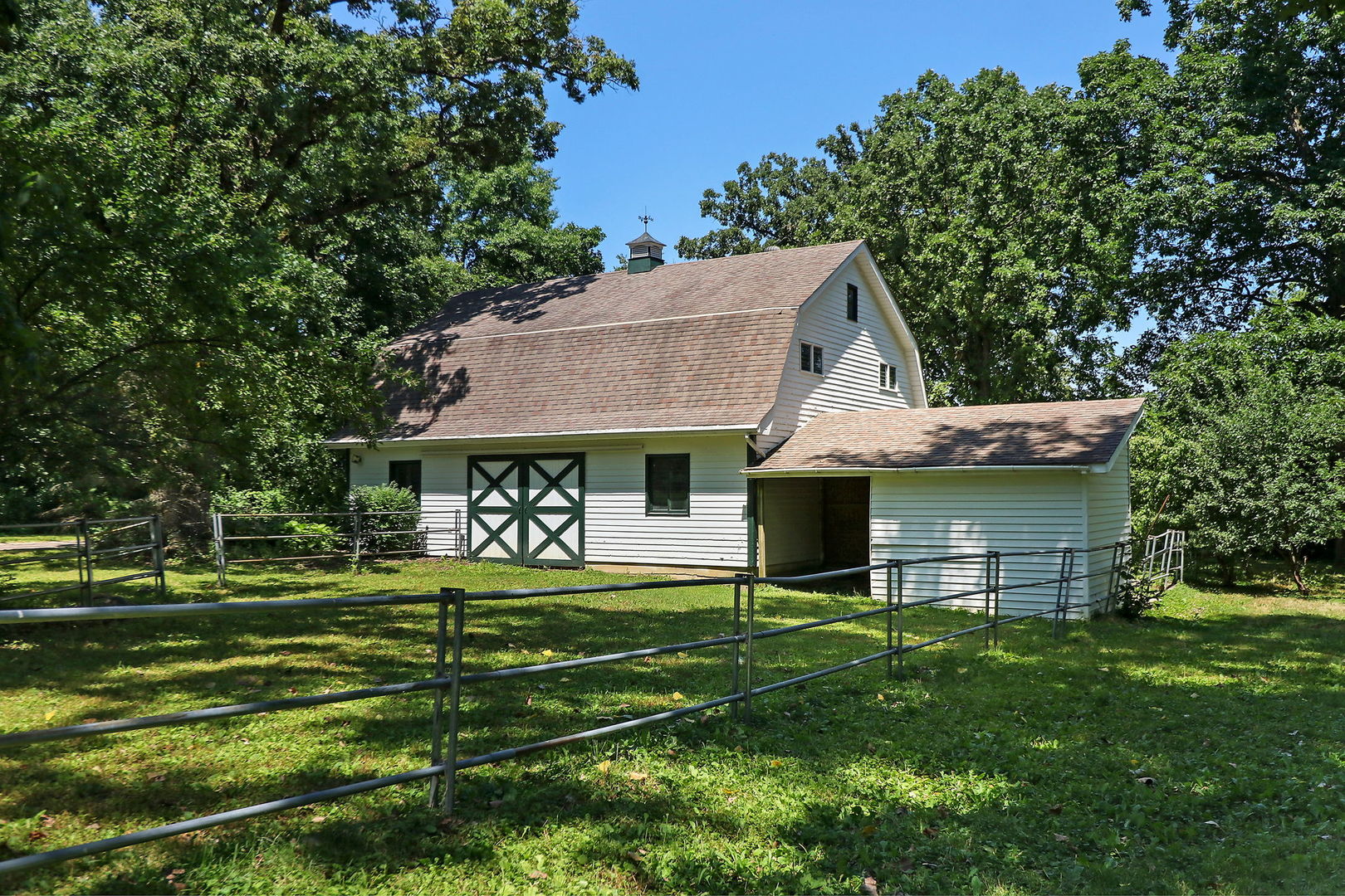 4602 Sunnyside Road Woodstock, IL 60098 - Photo 50 of 73 a front view of a house with a garden