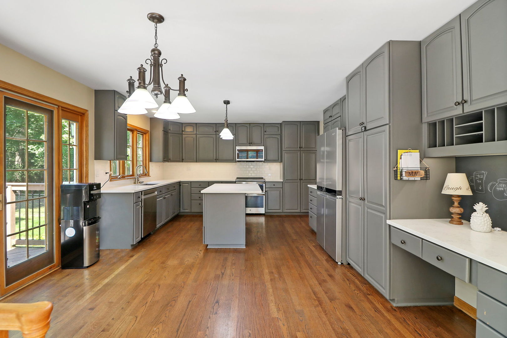 4602 Sunnyside Road Woodstock, IL 60098 - Photo 5 of 73 a large kitchen with a lot of cabinets and stainless steel appliances