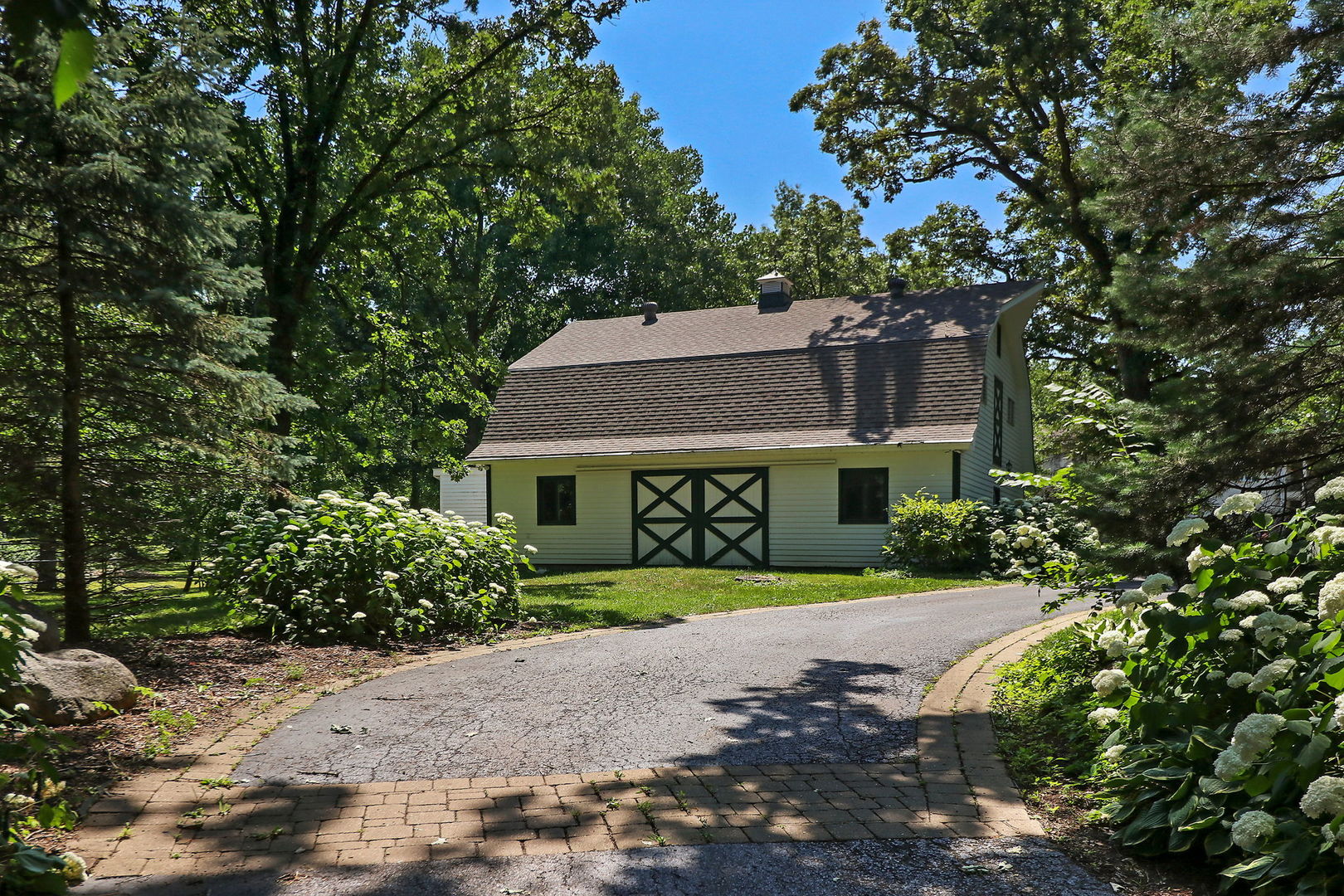 4602 Sunnyside Road Woodstock, IL 60098 - Photo 51 of 73 front view of a house with a yard