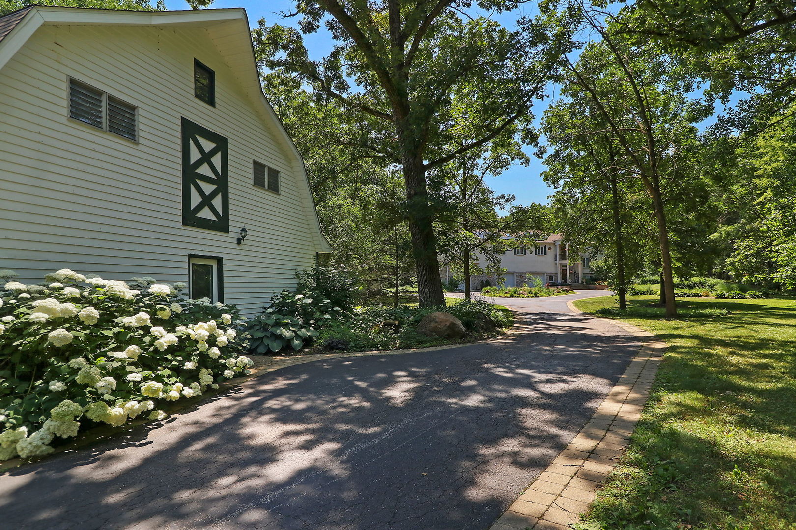 4602 Sunnyside Road Woodstock, IL 60098 - Photo 52 of 73 a view of a house with a yard and tree