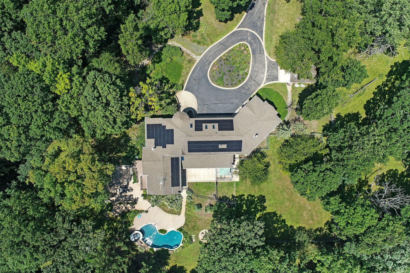 4602 Sunnyside Road Woodstock, IL 60098 - Photo 60 of 73 an aerial view of a house with a yard and swimming pool