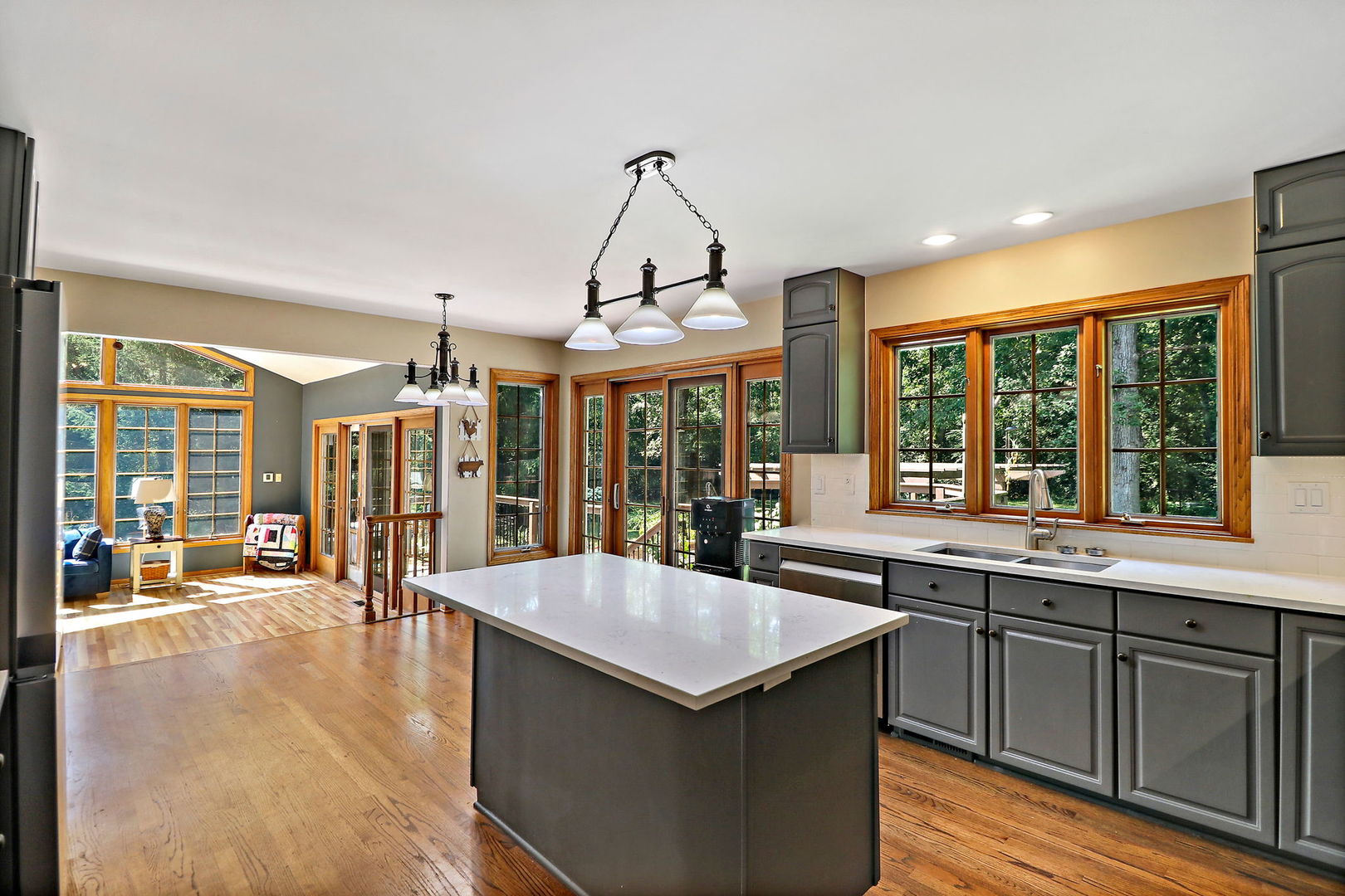 4602 Sunnyside Road Woodstock, IL 60098 - Photo 6 of 73 a kitchen with stainless steel appliances granite countertop a stove and large window