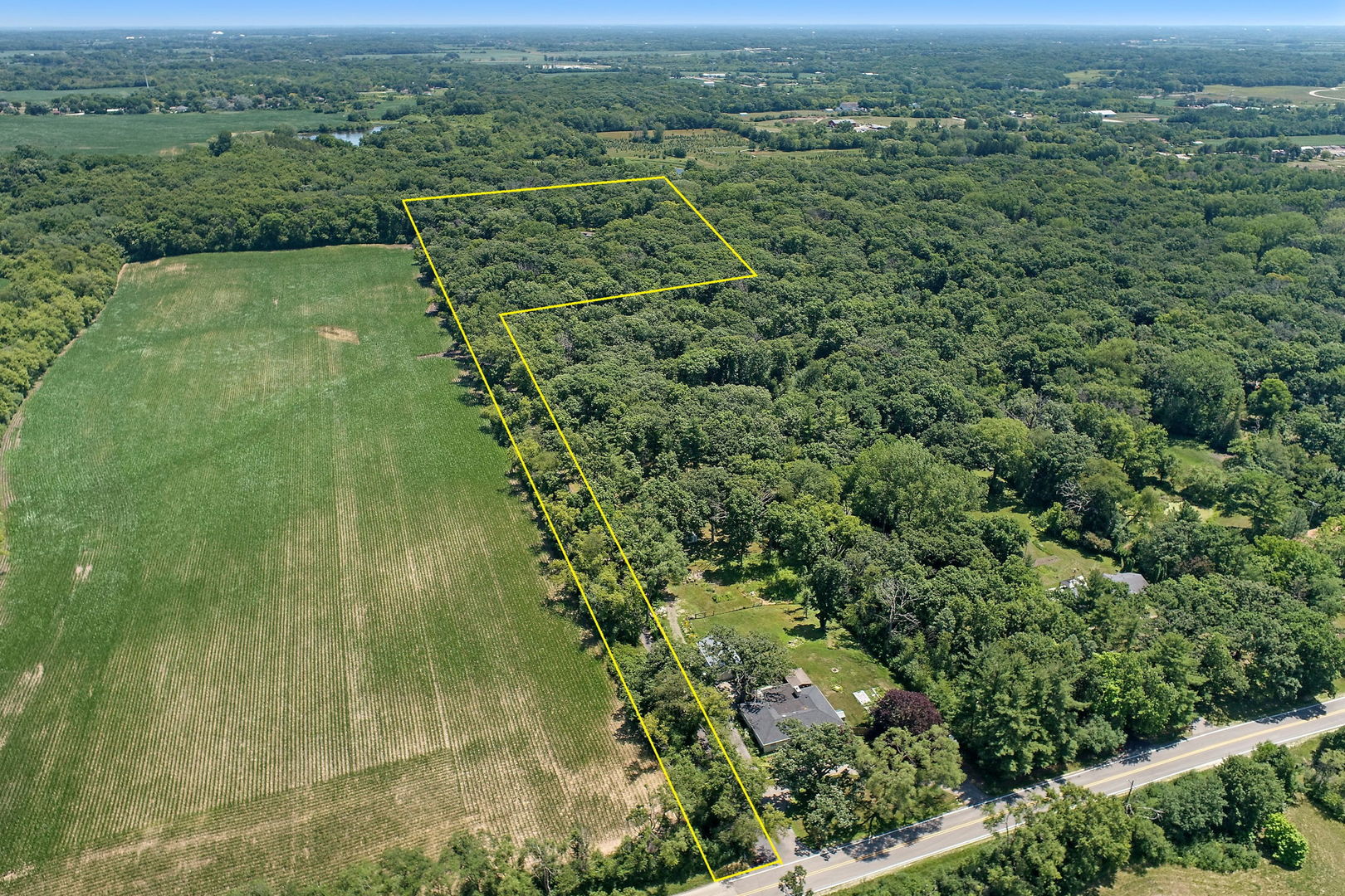 4602 Sunnyside Road Woodstock, IL 60098 - Photo 63 of 73 an aerial view of residential houses with outdoor space and trees