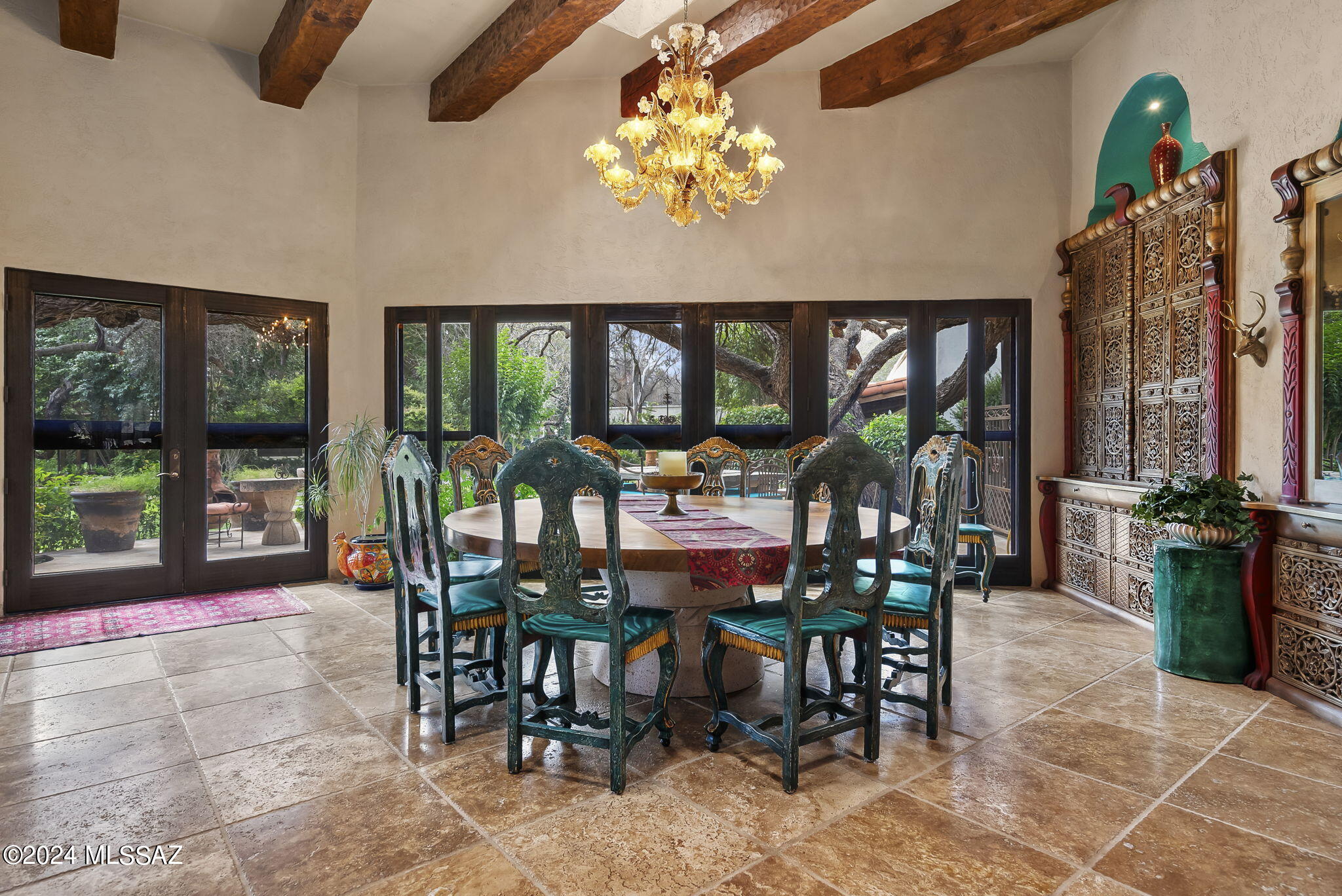 45 Clark Crossing Road Tumacacori, AZ 85640 - Photo 10 of 50 a view of a dining room that has a table and chairs