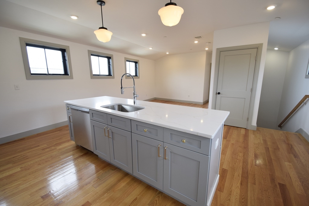 15 Maywood Street, Unit 4 Boston, MA 02119 - Photo 7 of 14 a bathroom with a sink and mirror