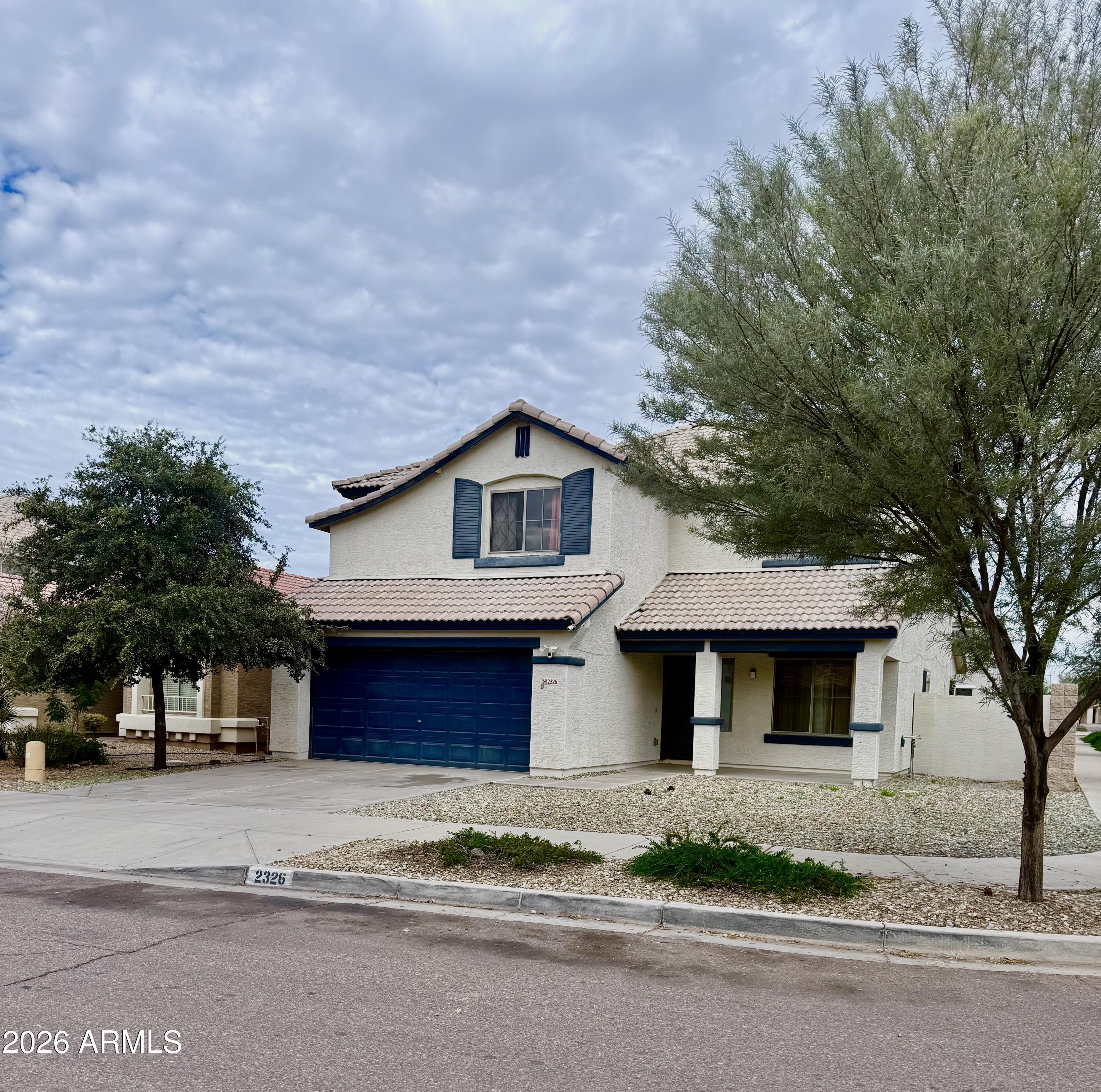 2326 West Gaby Road Phoenix, AZ 85041 - Photo 1 of 75 a front view of a house with a yard and garage