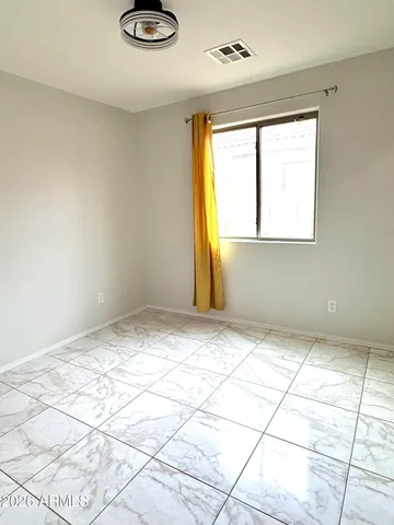 a bathroom with a bathtub shower sink mirror and toilet